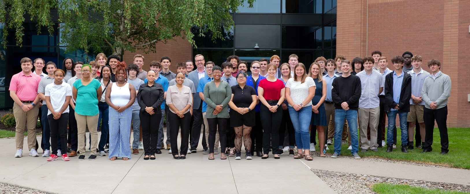 The Golisano Institute's inaugural class poses for a group photos.