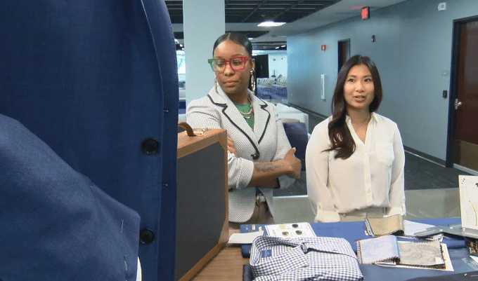 Golisano students look at the new blazers coming to the on-campus Clothing Closet.