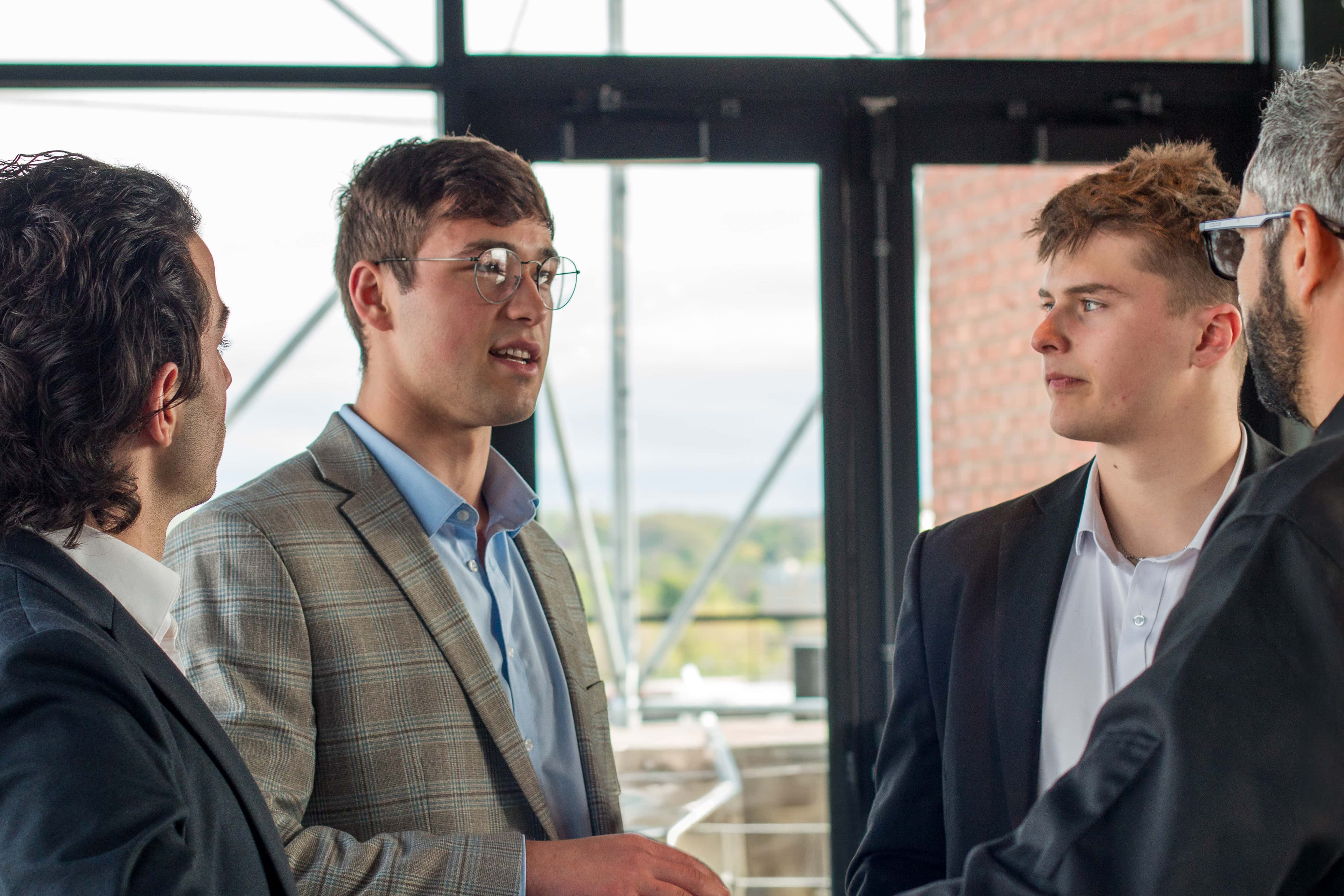 Students chatting at a networking event.
