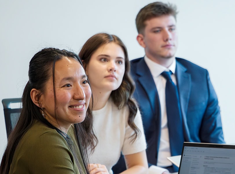 Students smiling while learning in class.