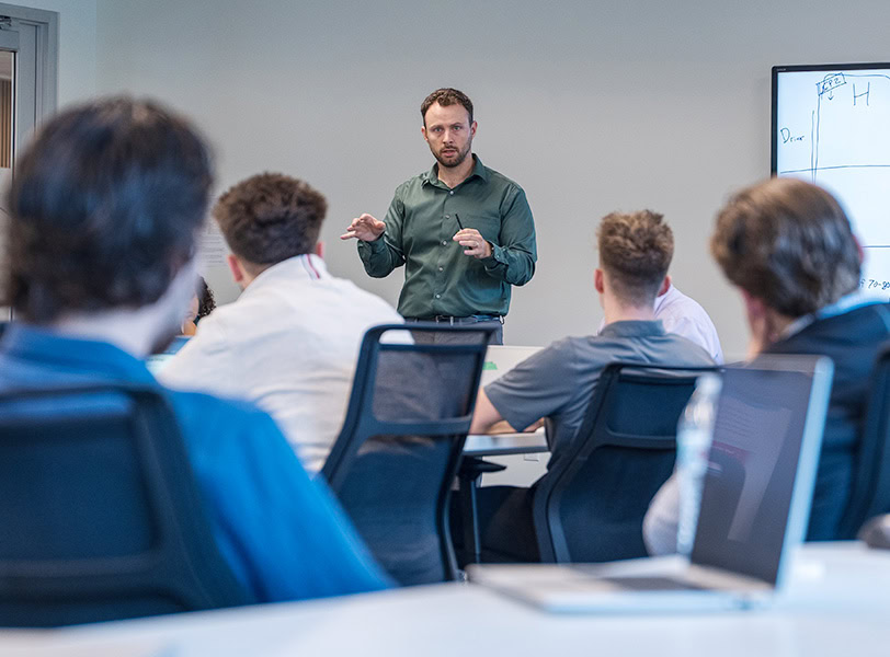 An instructor teaching a class of students.