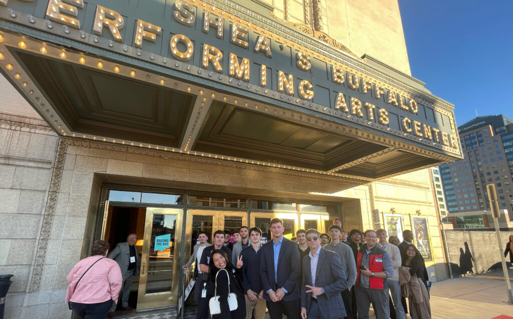 Students from Golisano Institute for Business and Entrepreneurship pose for a photo in front of Shea's Performing Arts Center in Buffalo, NY.