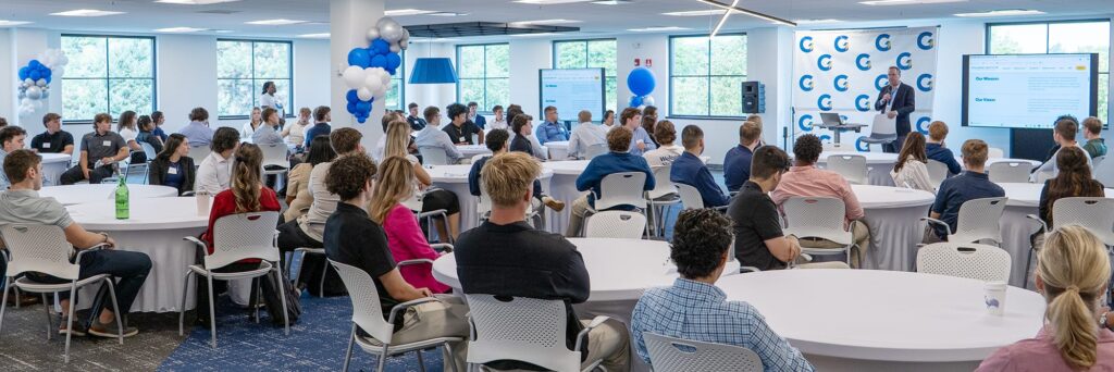A group of students listening to a presentation.