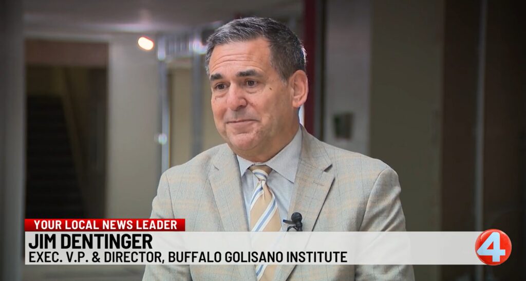 Jim Dentinger, executive vice president & Buffalo regional director, talks to a reporter about Golisano Institute's opening of a new campus center in Buffalo, New York.