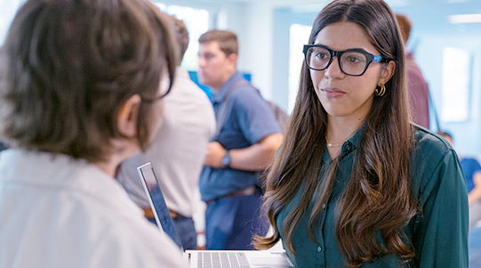 A student and a business partner in conversation