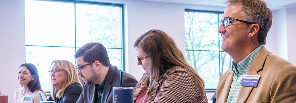 A panel of judges listens to a pitch competition