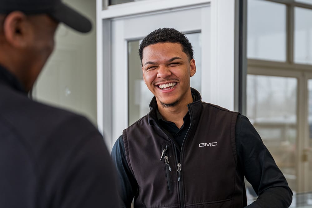 Alumni Jordan Kujawski poses for photos at Bob Johnson Buick GMC in Rochester, N.Y. on February 12, 2026.