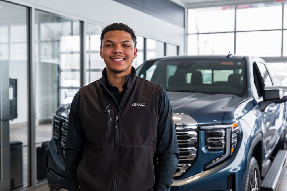Alumni Jordan Kujawski poses for photos at Bob Johnson Buick GMC in Rochester, N.Y. on February 12, 2026.