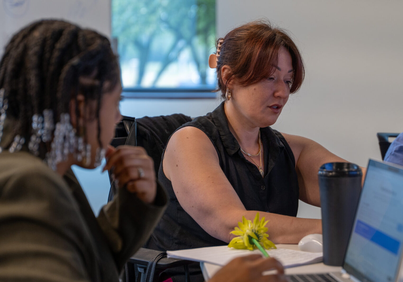 A student in a life-long learning environment works with a peer.